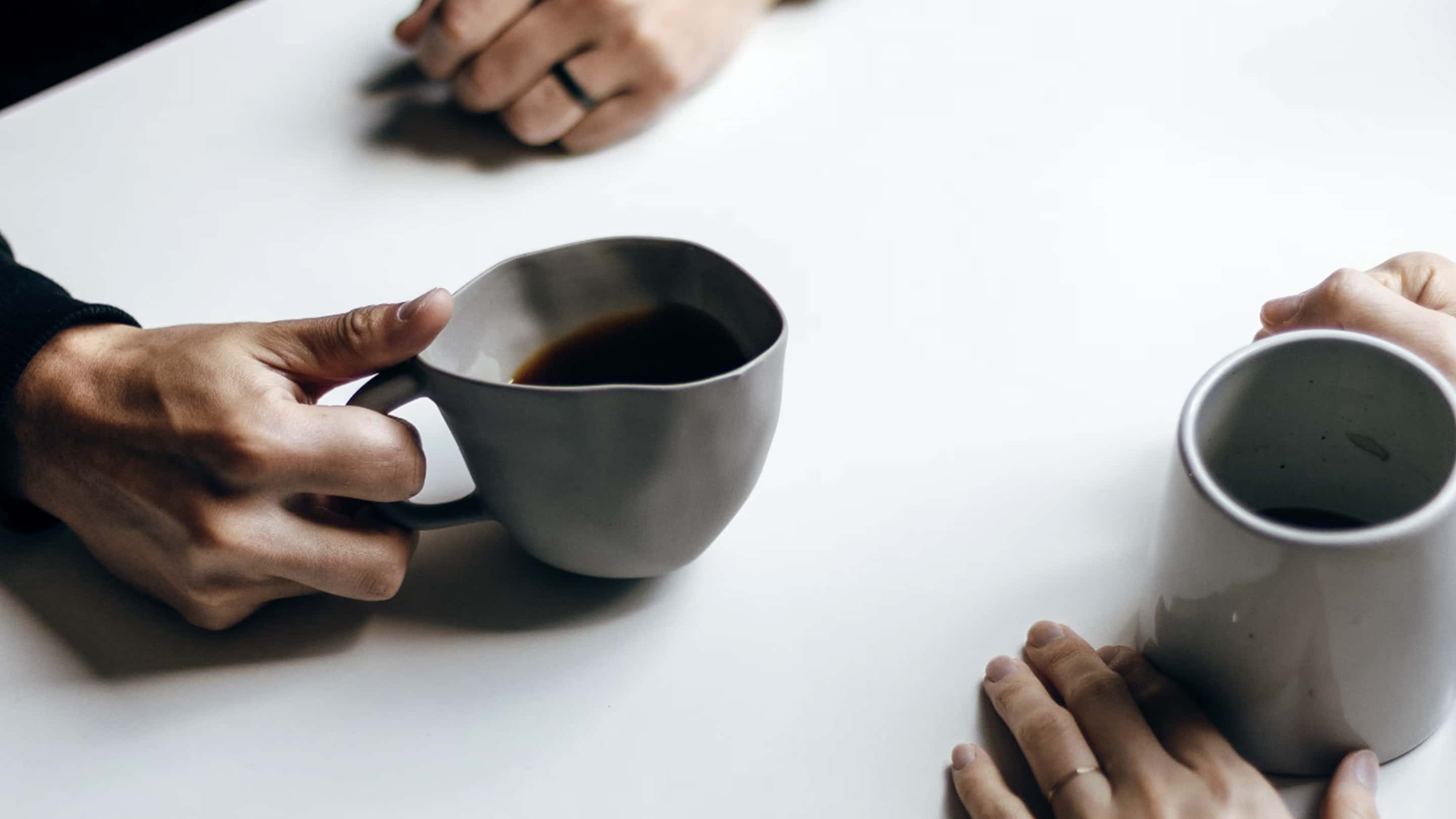 Two people sit opposite each other during Mediation Services